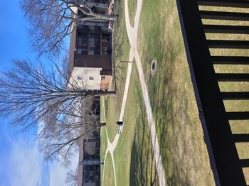 A tall building with a white pathway in front of it.