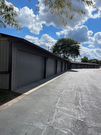 A long row of garage doors are closed.