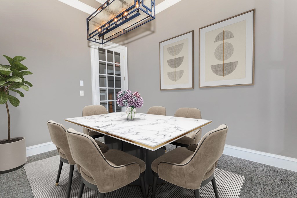 a dining room with a marble table and chairs