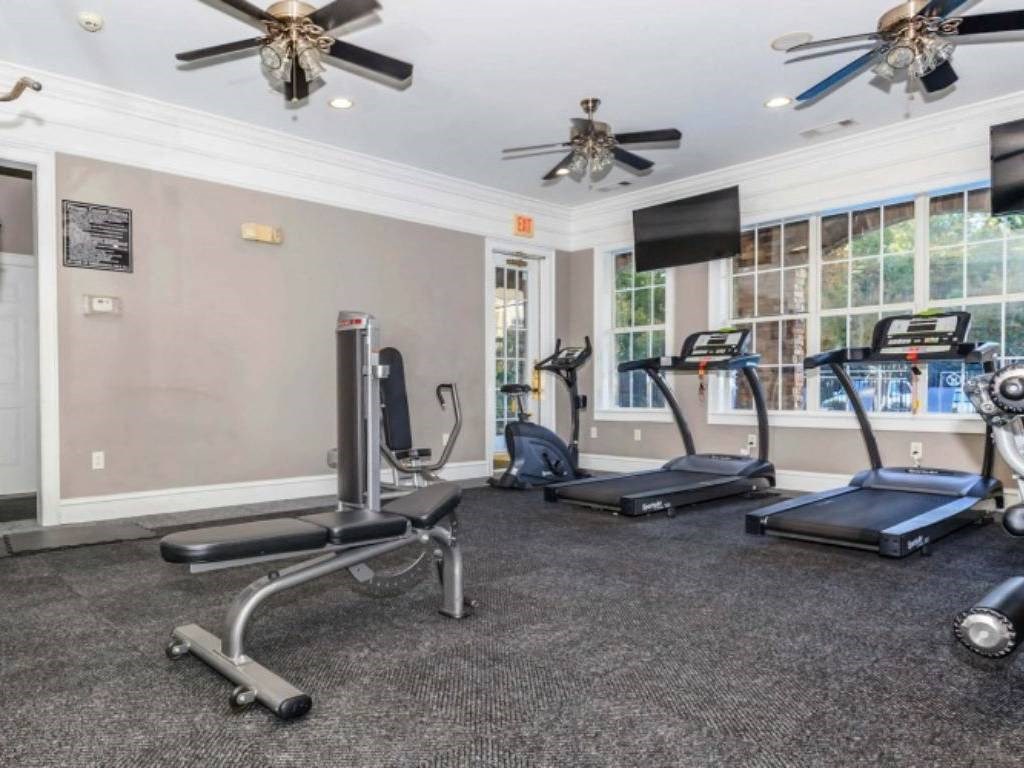 the gym has plenty of machines and ceiling fans