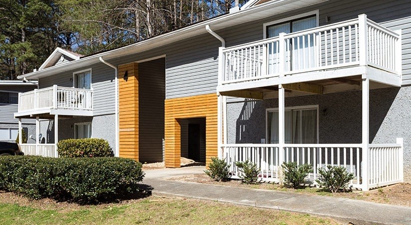 a yellow and with a porch