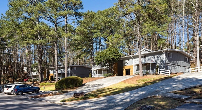 a group of houses on the side of a road