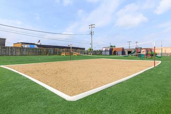 A baseball field with a sand pit in the middle.