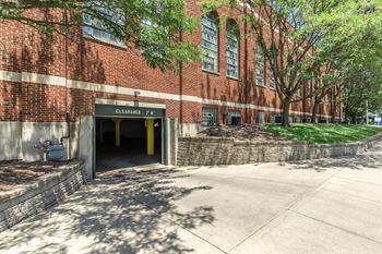 A red brick building with a clearance sign on the door.