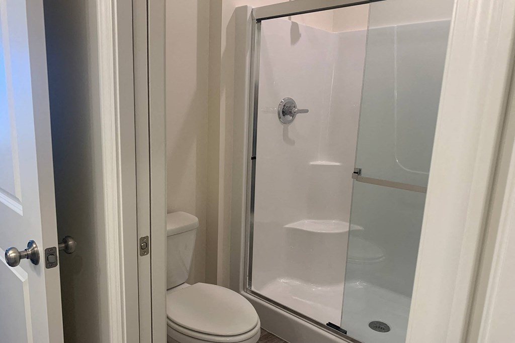 a small bathroom with a toilet and a shower
