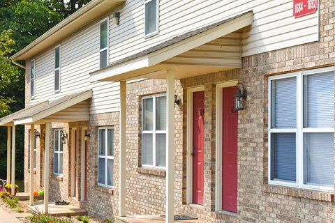 A house with a red door and windows.
