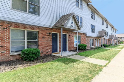 A row of houses with a blue door in the foreground.