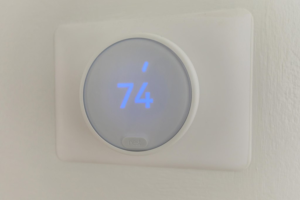 A Pest control device showing 74 degrees.