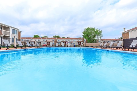 A large swimming pool in a residential area.