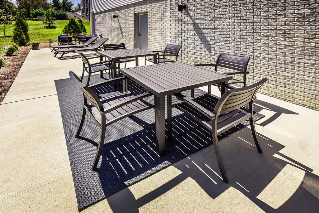 A set of outdoor furniture is arranged on a patio.
