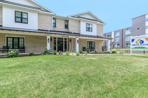 A house with a lawn in front of it.
