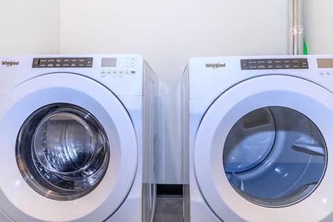Two Whirlpool washing machines side by side.