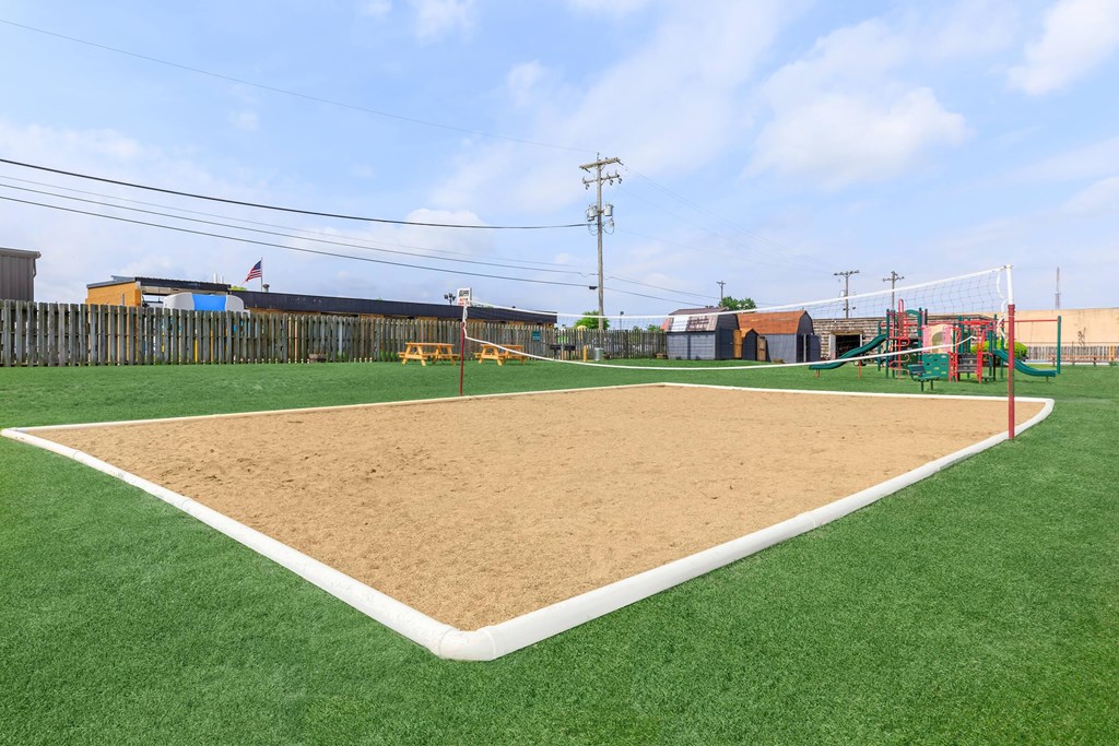 A baseball field with a sand pit in the middle.