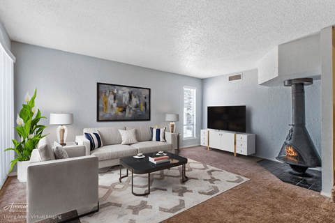 a living room with a fireplace and a couch