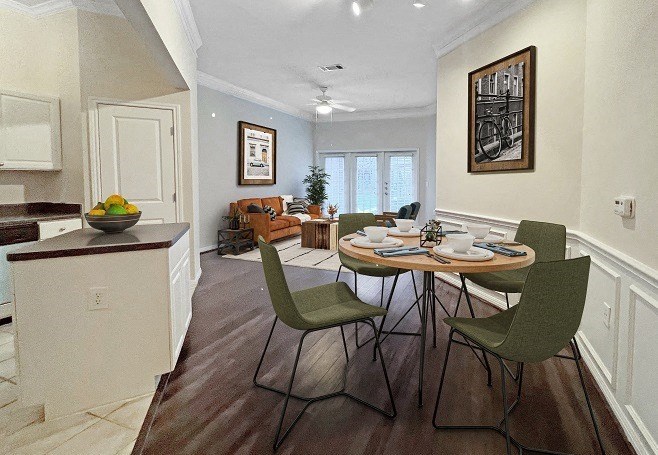 a dining room and living room with a table and chairs