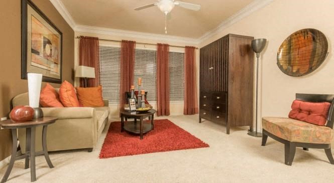 a living room with a couch and a table