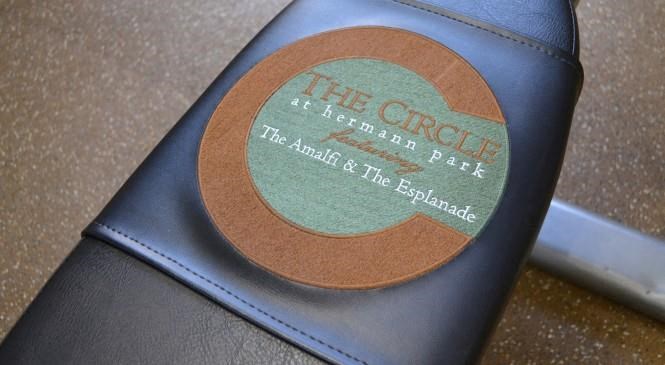 a leather seat with a circular label on the back of it