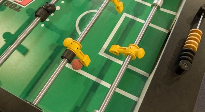 a green and yellow football field on a machine