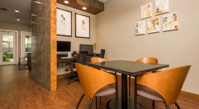 a conference room with a table and chairs