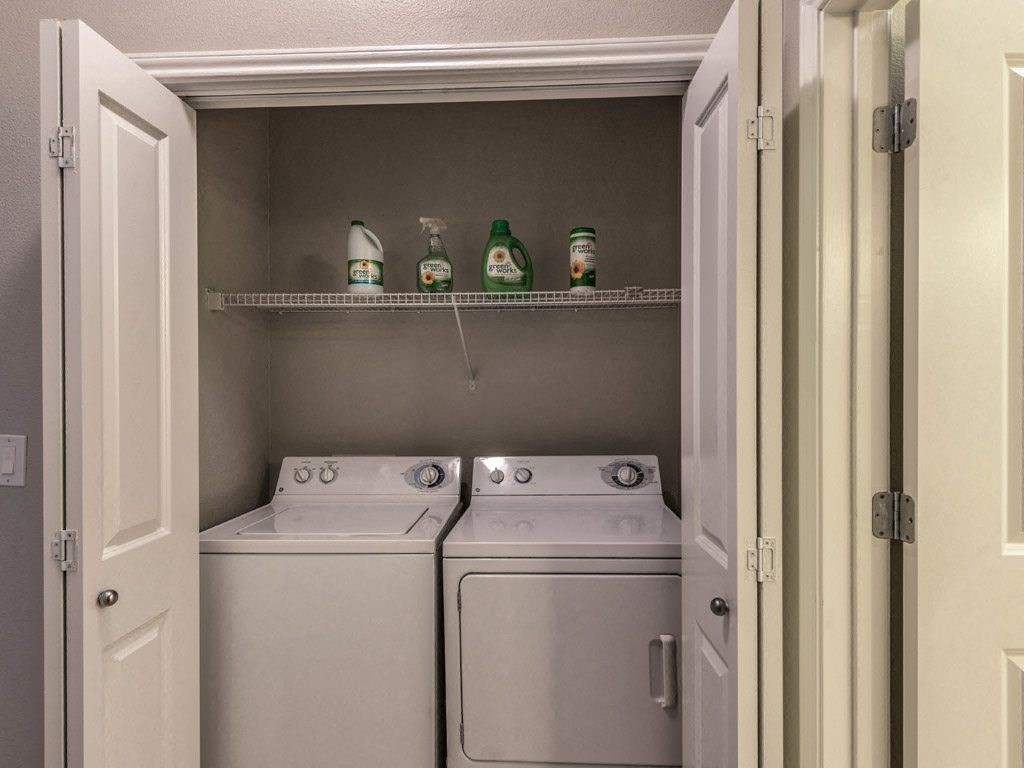 a washer and dryer in a small laundry room