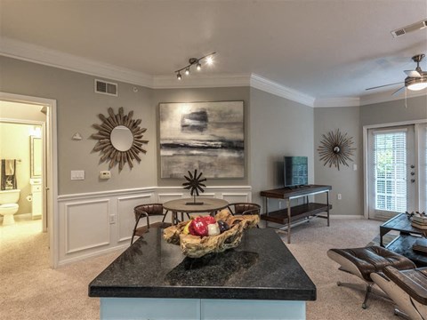 a living room with a table and a couch