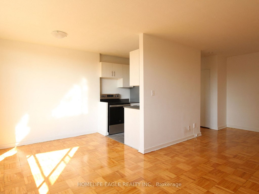 an empty living room and kitchen in a house