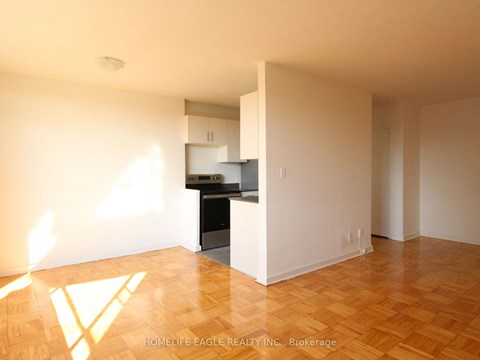 an empty living room and kitchen in a house