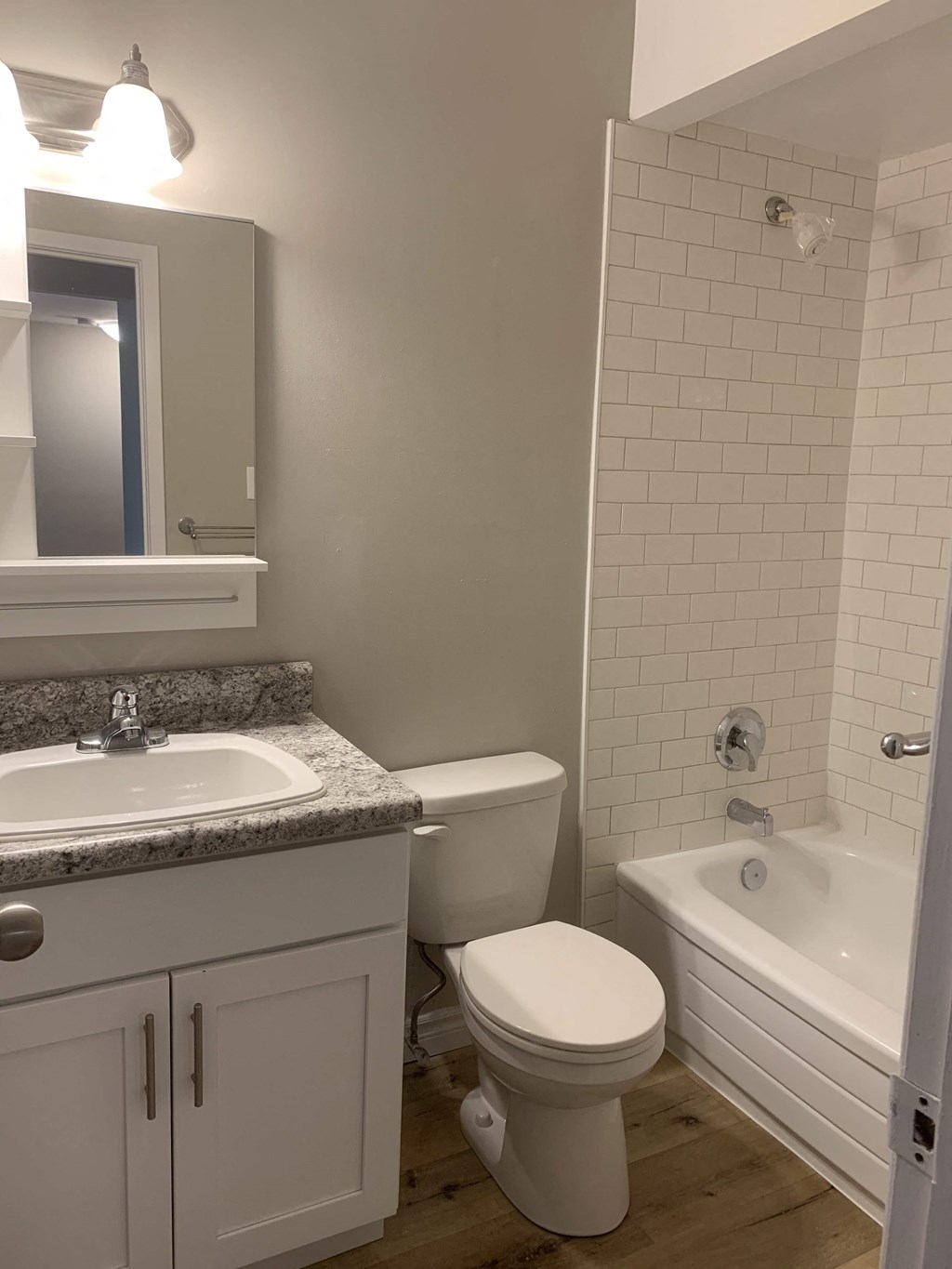 a bathroom with a toilet and a sink and a tub