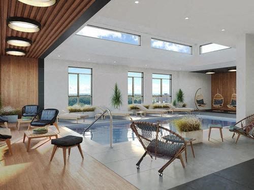 a room with a pool and chairs in it