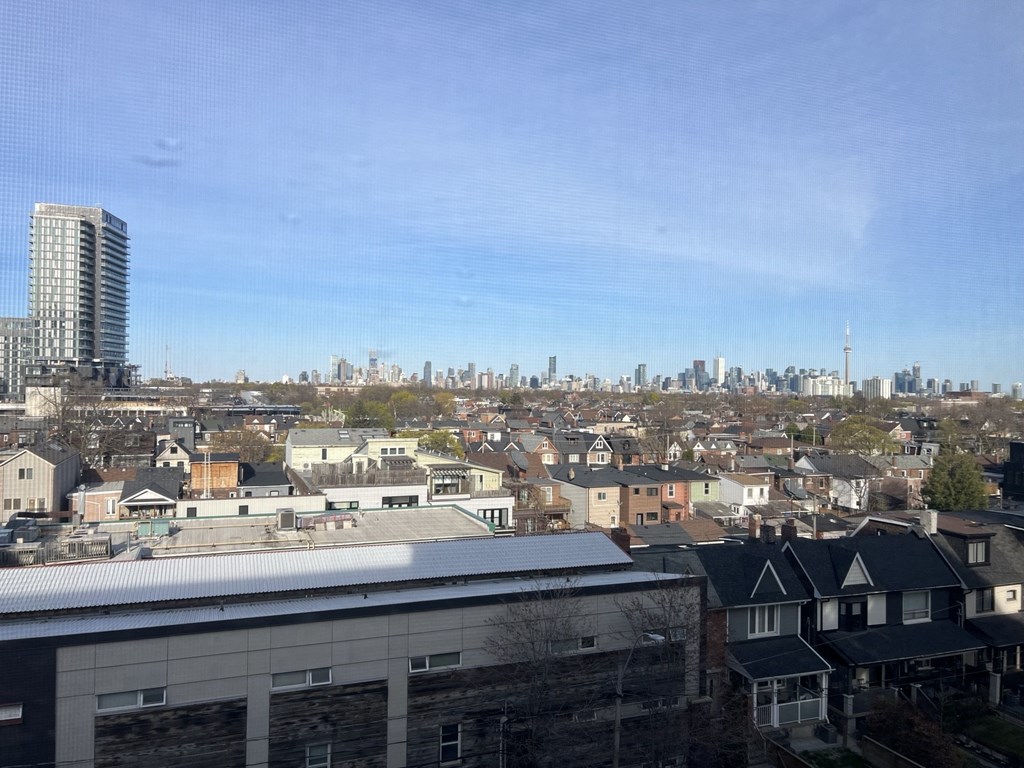 the view of the city from the roof of a building