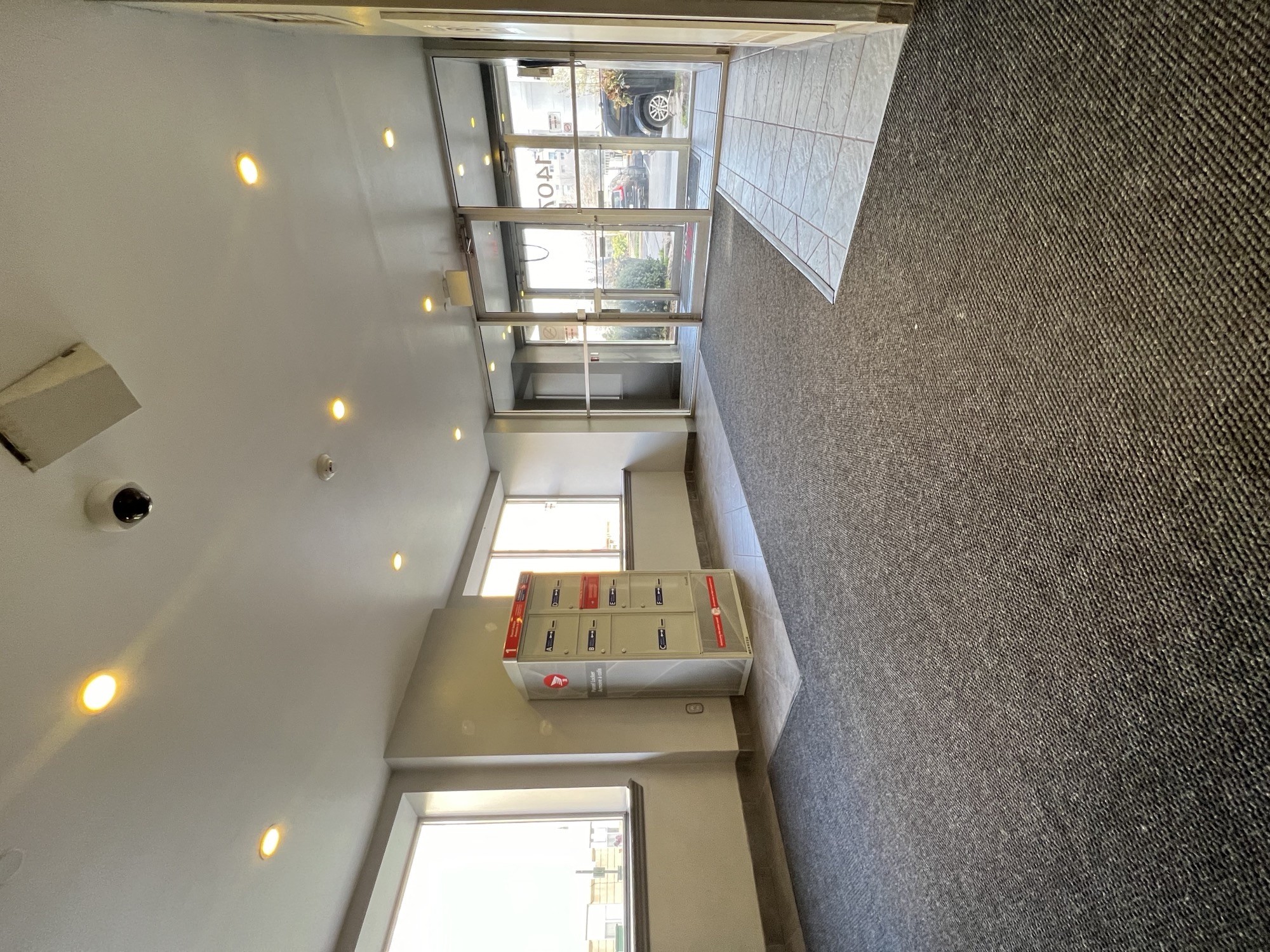 a view of a room with a shuffleboard table in the middle