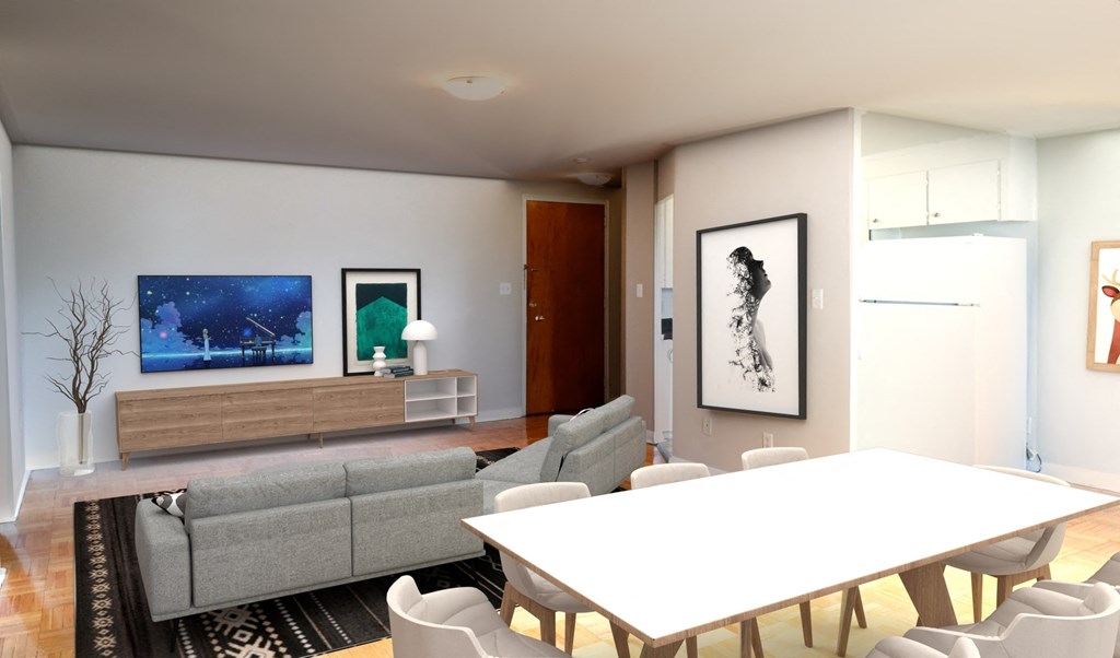 a living room with a white table and a gray couch