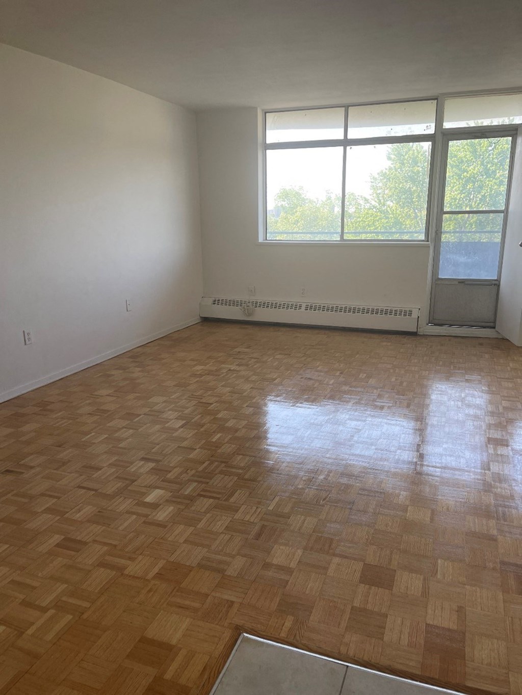 an empty room with a wood floor