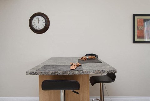 a table with a clock on the wall