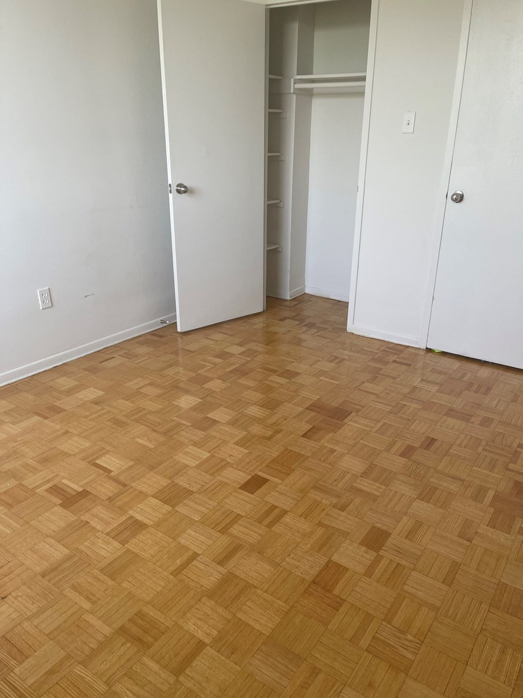 an empty room with a wood floor