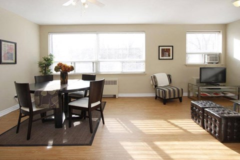 a living room with a table and a tv