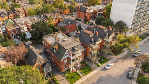 A bird's eye view of a residential area with a mix of modern and traditional houses.
