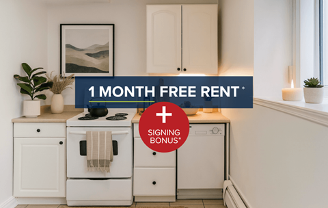 A kitchen with a stove, oven, and cabinets is advertised with a 1 month free rent and signing bonus offer.