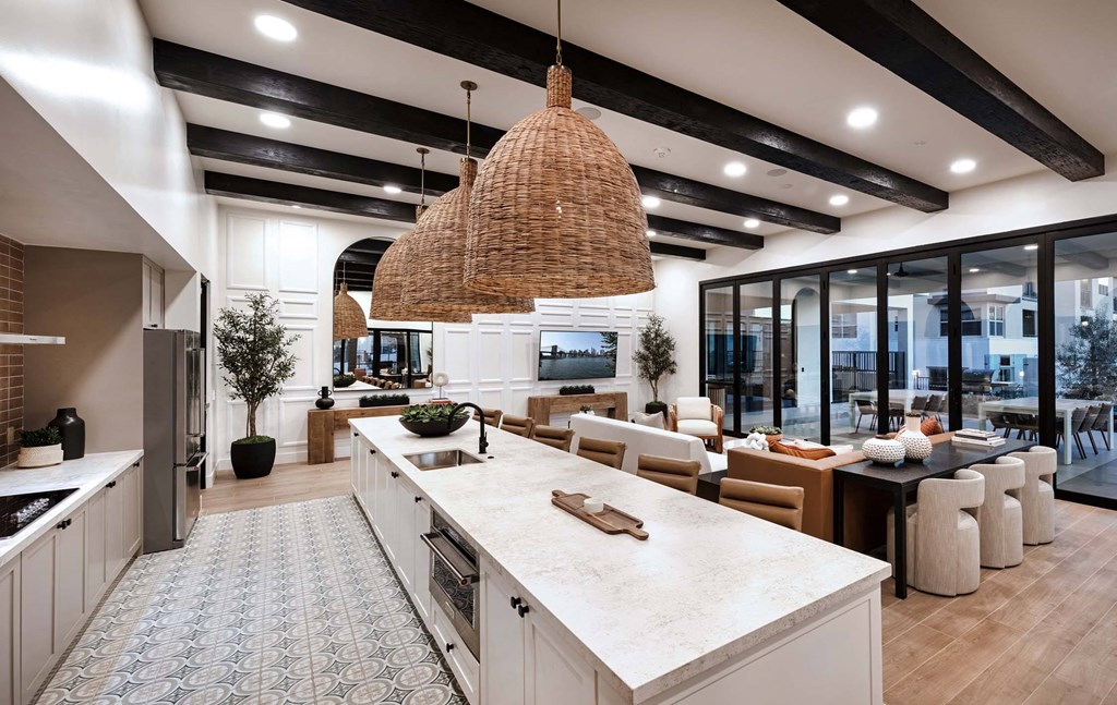 the kitchen is open to the living room and dining room at Luma at El Corazon Apartments, Oceanside, CA