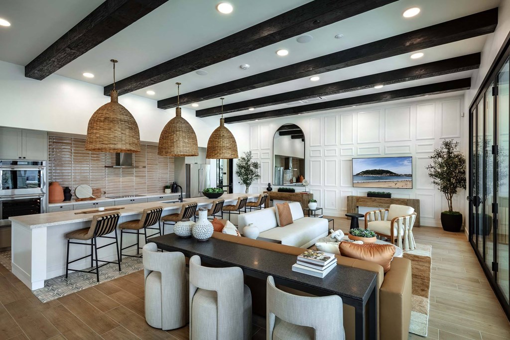 a large living room with a kitchen and a dining room at Luma at El Corazon Apartments, California 92056