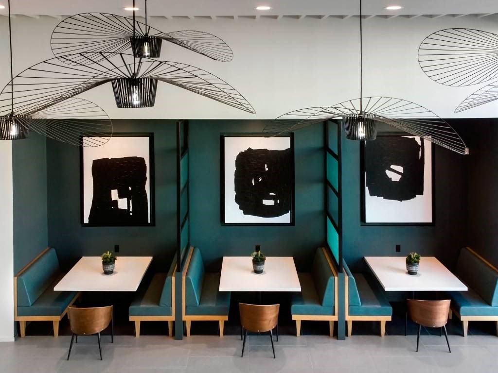 a dining room with tables and chairs