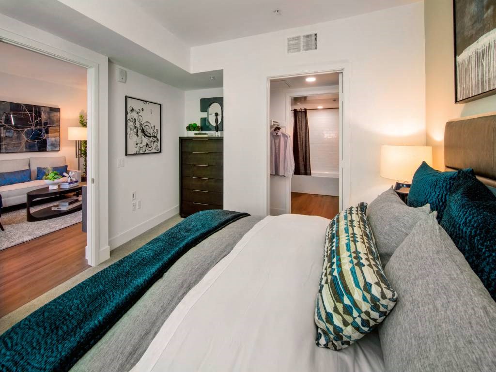 a bedroom with a bed and a closet