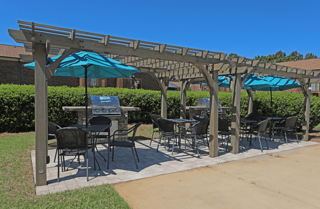a patio with umbrellas and tables