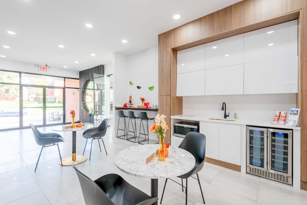 a kitchen and dining area with a table and chairs