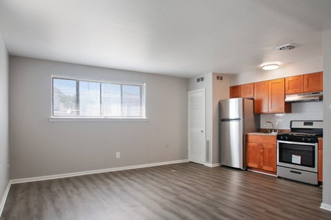 A kitchen with wooden cabinets and stainless steel appliances.