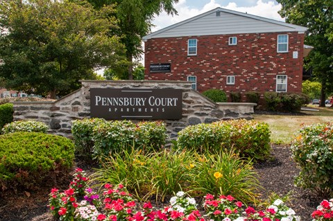 A brick building with a sign that says PENNSYLVANIA COURT.
