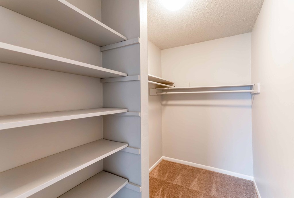a walk in closet in a 555 waverly unit