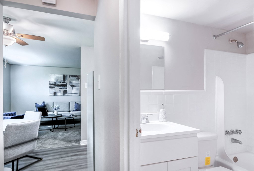 a bathroom with a bathtub and a sink