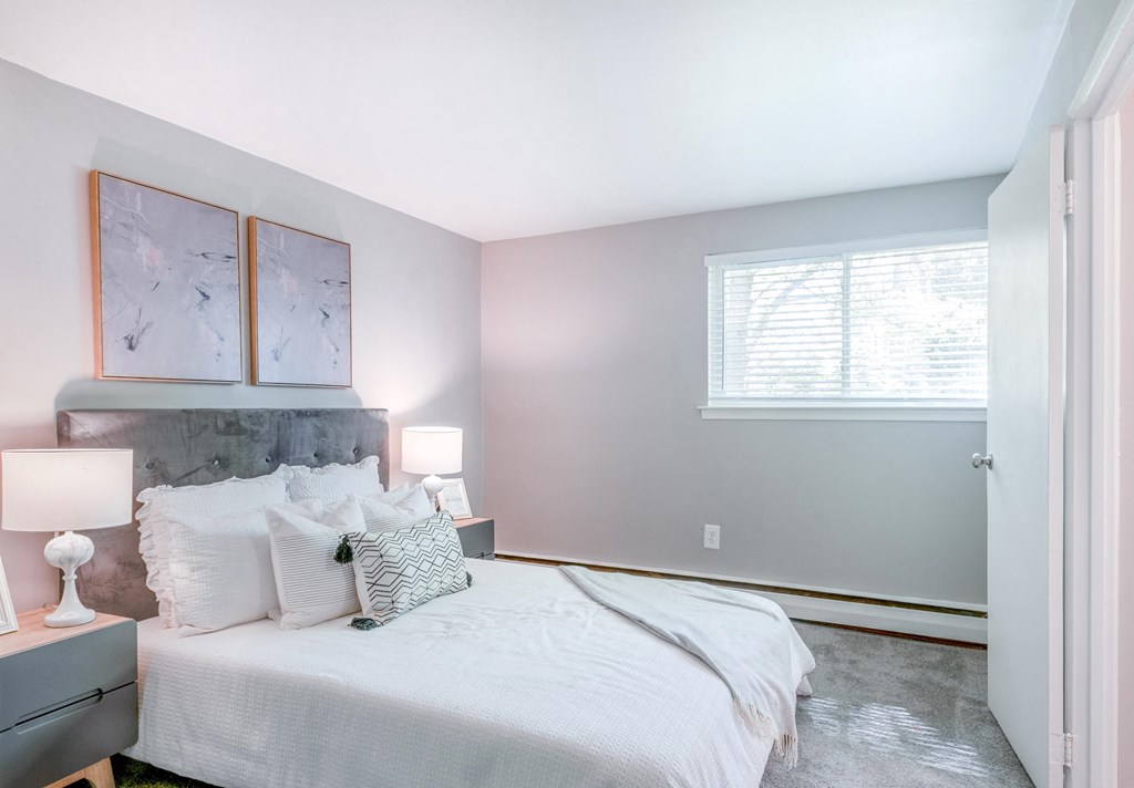 a bedroom with a bed and two night stands