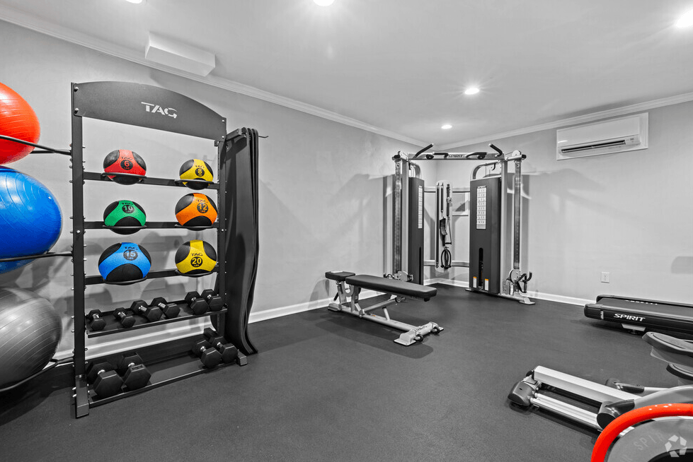 a home gym with weights and equipment